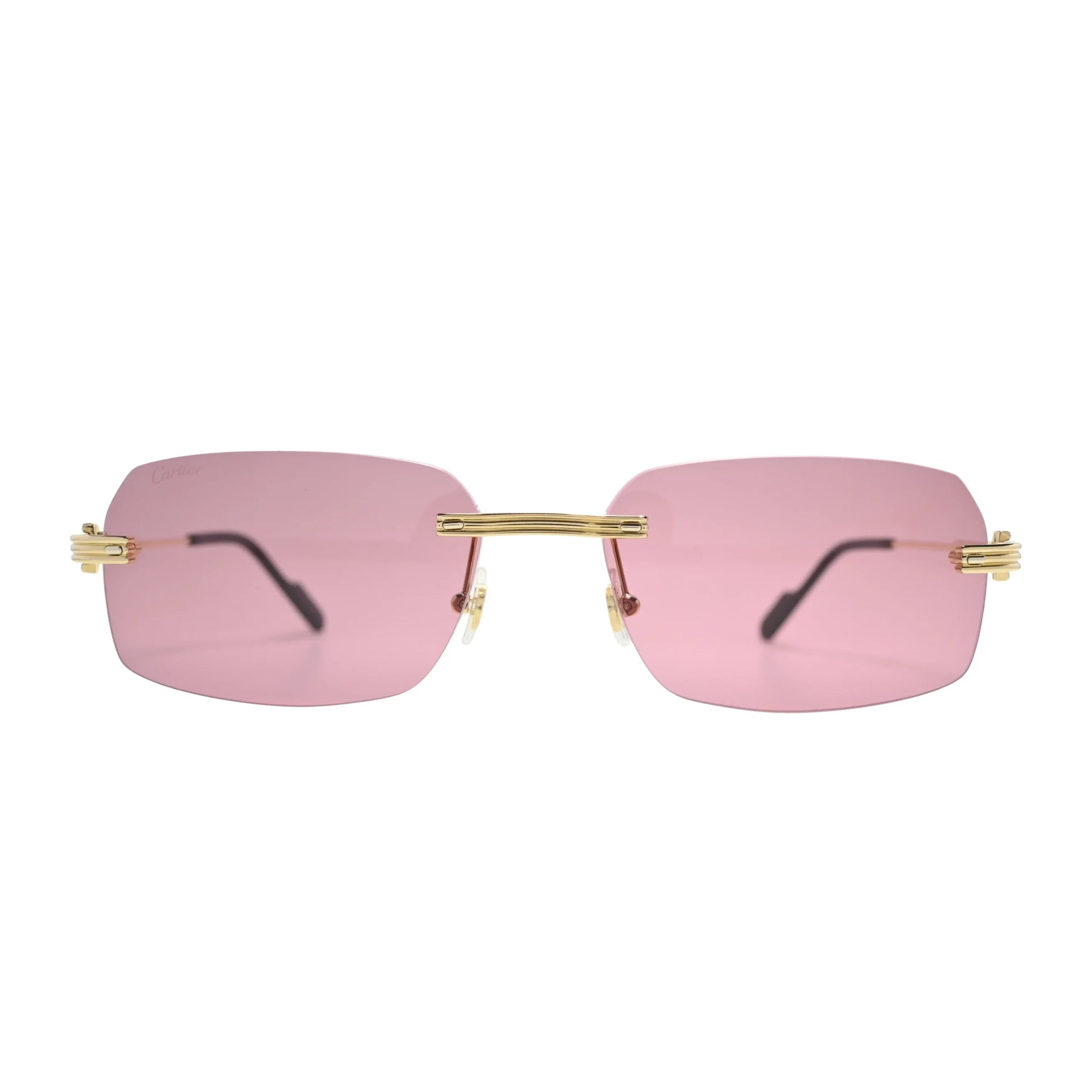 Front view of Cartier CT0271S010 rectangular rimless frame with pink nylon lenses and gold bridge bar
