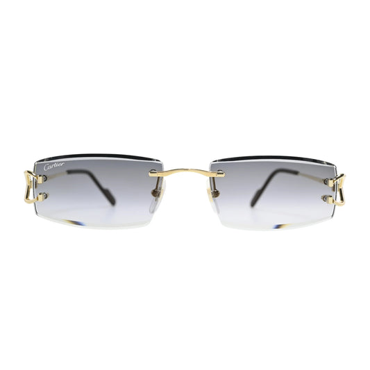 Front view of Cartier CT0465S001 grey gradient rimless sunglasses men with gold bridge bar and Cartier script on left lens