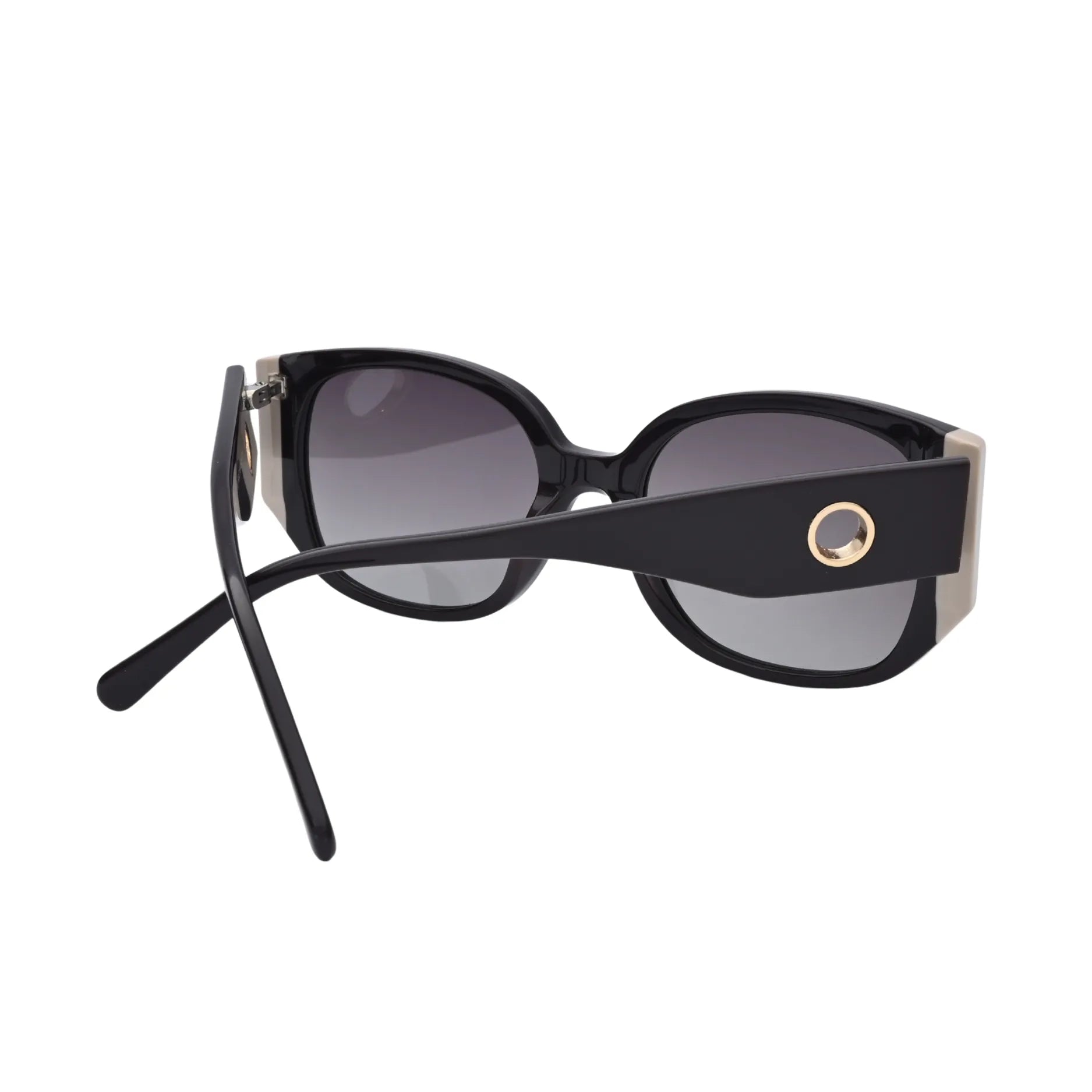 Side view of glossy black frame sunglasses with round metal temple detail
