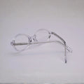 Side view of clear blush-pink full frame with visible metal core in temples (S036)