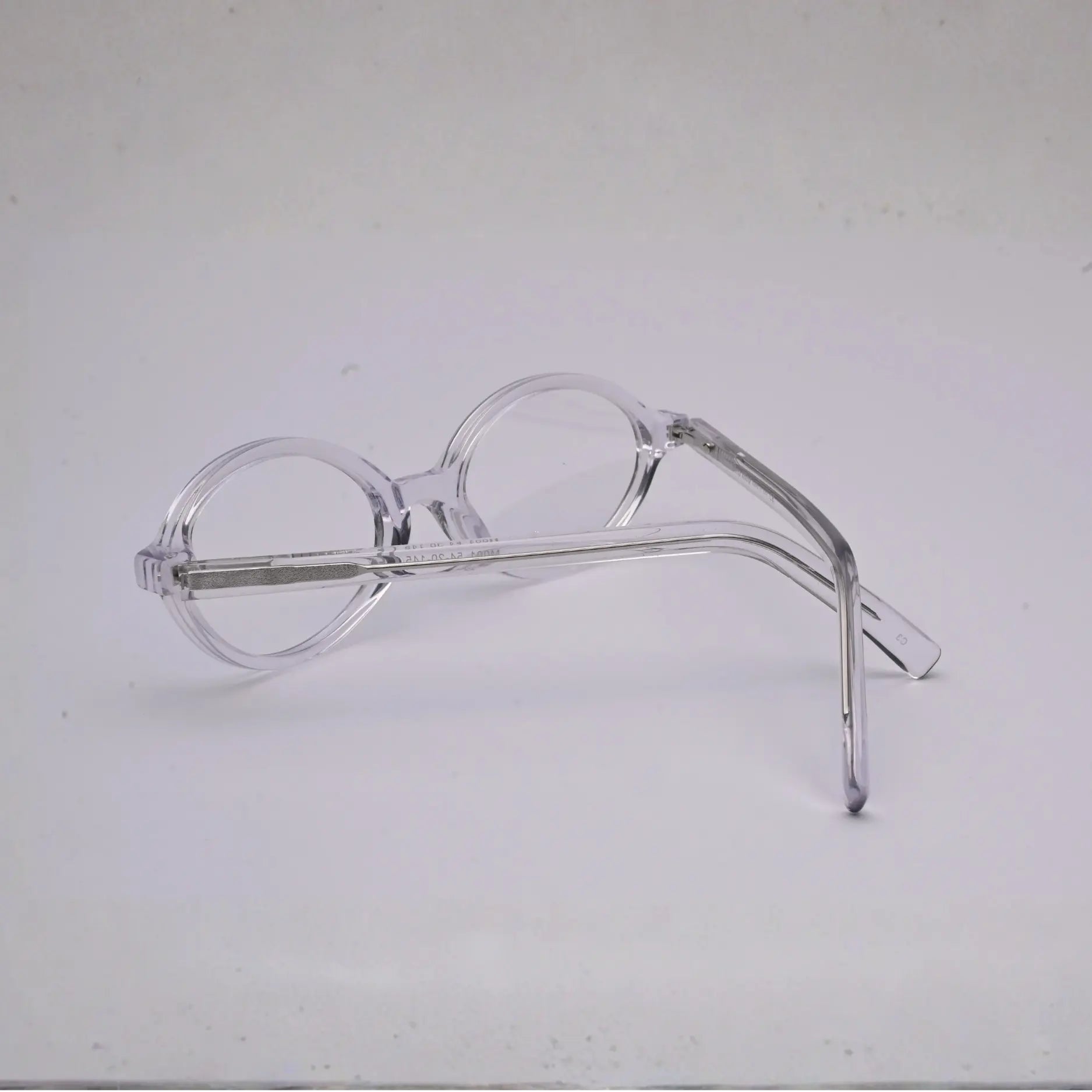 Side view of clear blush-pink full frame with visible metal core in temples (S036)