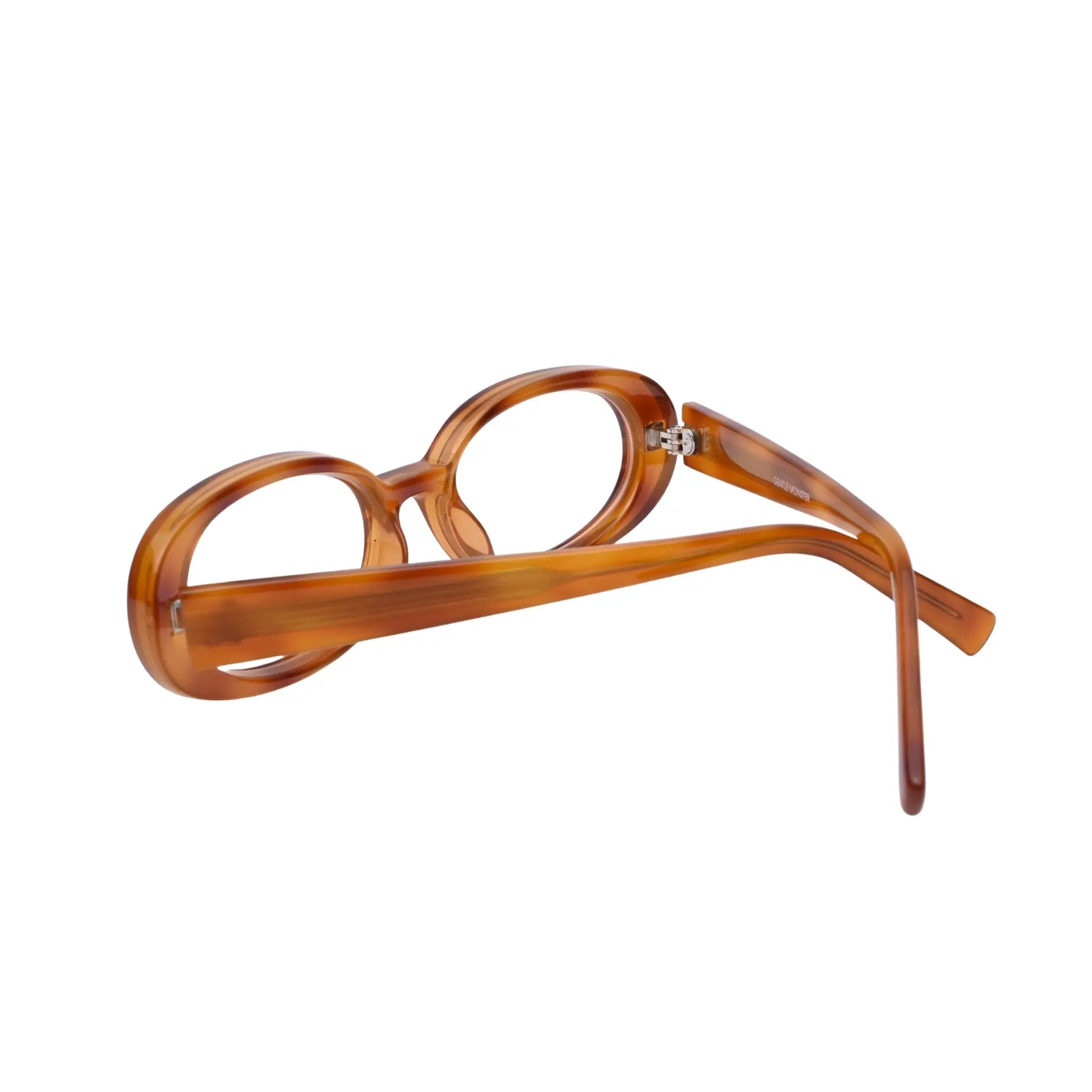 Side angle of translucent amber oval full frame with long temples