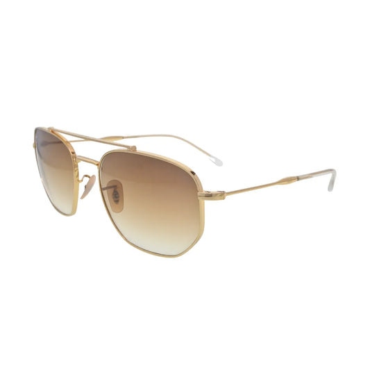 Side angle profile of polished Arista gold metal eyewear displaying thin temples and adjustable silicone nose pads.