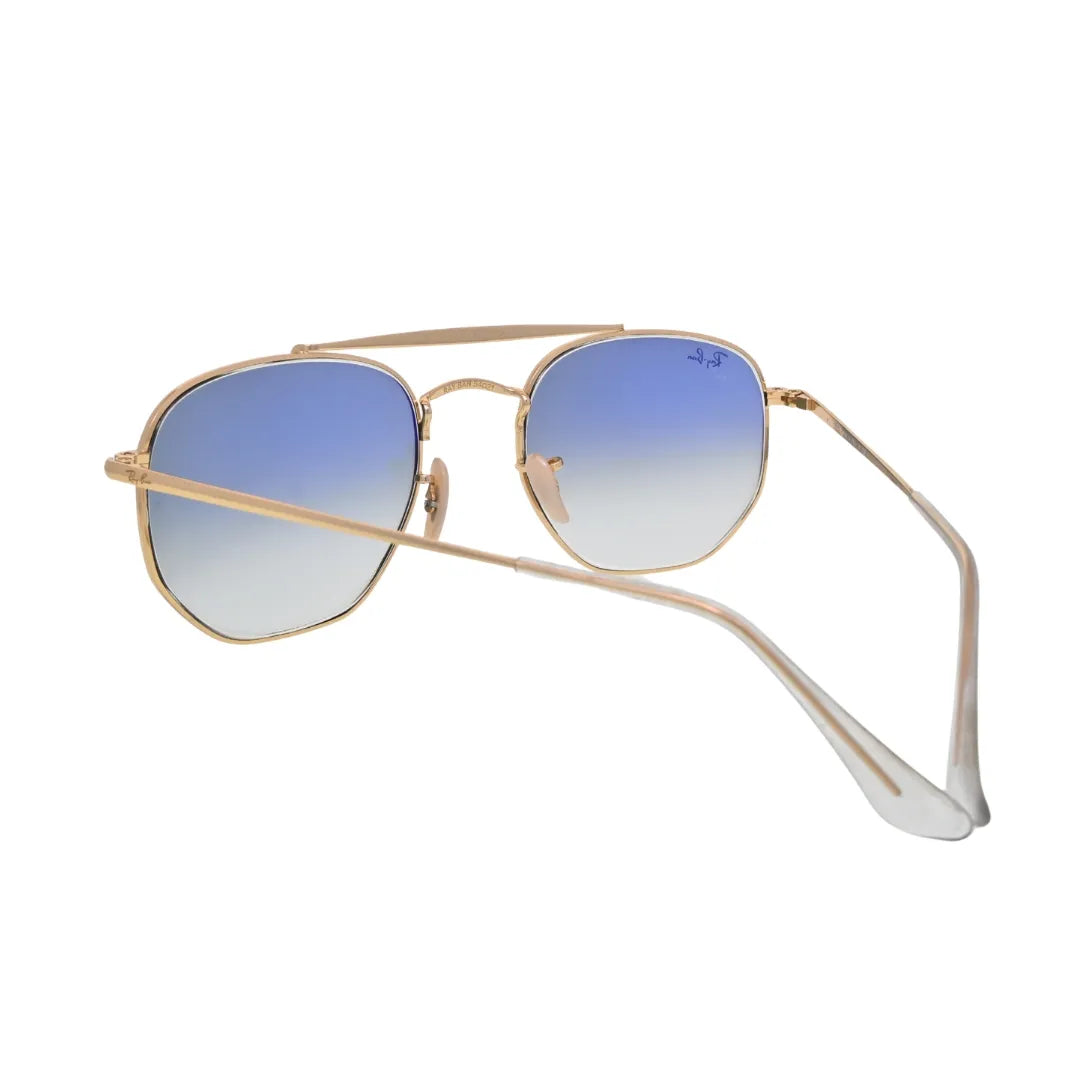 Ray-Ban Marshal gold frame sunglasses with light blue gradient lenses three-quarter angle