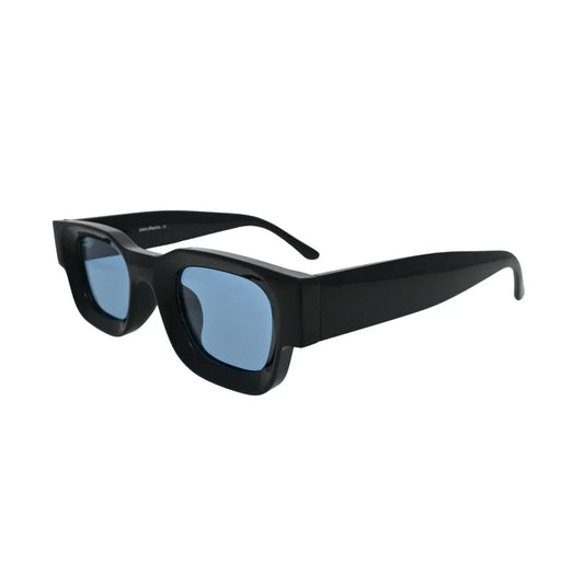 Three-quarter side view of extremely thick glossy black rectangular sunglasses with pale blue lenses showing deep block-like frame walls