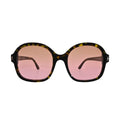 Tom Ford Hanley TF1034 52F front-facing view showing oversized dark havana square frame and full pink gradient lens tint