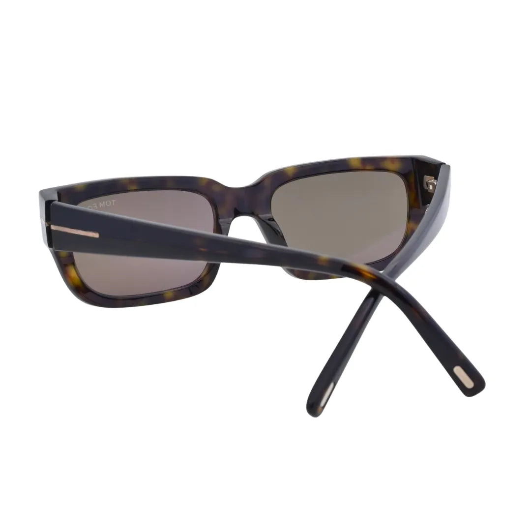 Three-quarter angle of Tom Ford Ezra TF1075 52L rectangle sunglasses showing dark havana acetate, elongated temples, and signature Tom Ford side detailing