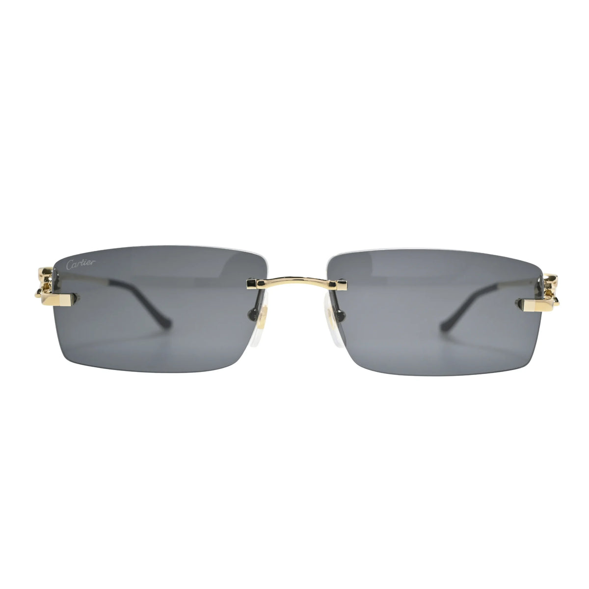 Front view of Panthère rimless Cartier sunglasses CT0430S001 with grey nylon lenses, gold bridge bar and Cartier script on left lens