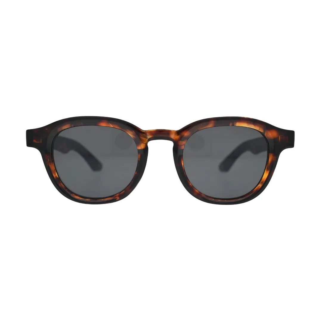 Round tortoise sunglasses front view — thick amber acetate frame with smoke grey tinted lenses, unisex retro style