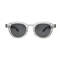 Front view of crystal clear round square sunglasses with tortoise shell arms and dark grey lenses