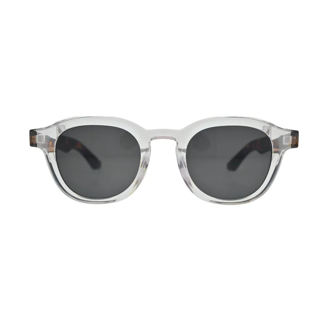 Front view of crystal clear round square sunglasses with tortoise shell arms and dark grey lenses