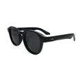Three-quarter side angle view of black panto round sunglasses showing thick acetate-style temples and silver hinge rivets