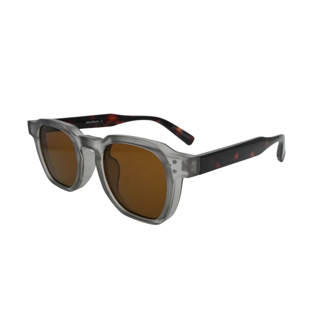 Three-quarter side view of chunky frosted grey square sunglasses with dark tortoise arms and warm amber brown lenses