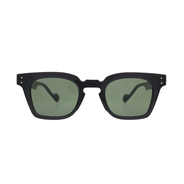 Front view of black square sunglasses with green lenses showing thick frame, notched cutout bridge, and silver rivet detail on temples