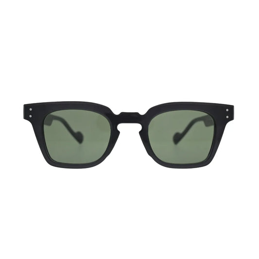 Front view of black square sunglasses with green lenses showing thick frame, notched cutout bridge, and silver rivet detail on temples