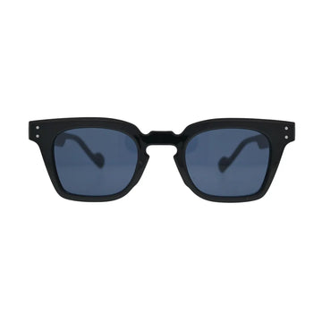 Front view of black square sunglasses with blue lenses showing thick frame, notched cutout bridge, and double silver rivets on temples
