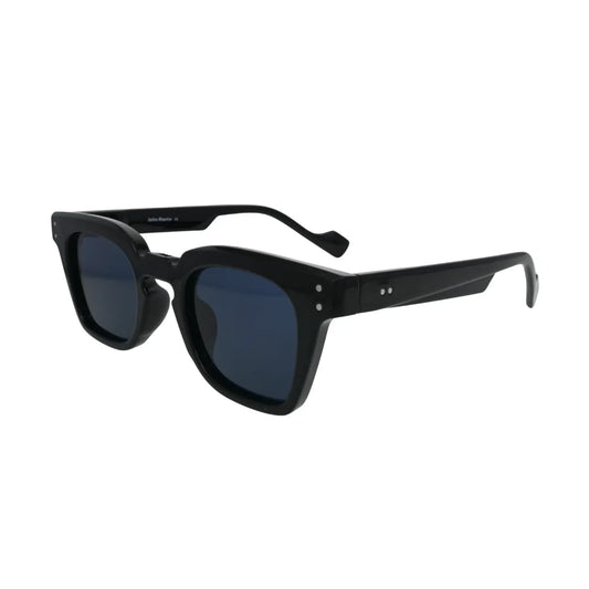 Three-quarter side view of chunky glossy black square sunglasses with dark navy blue lenses and silver rivet hinge detail