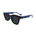 Three-quarter view of tortoise square sunglasses highlighting the bold solid blue temple arms.