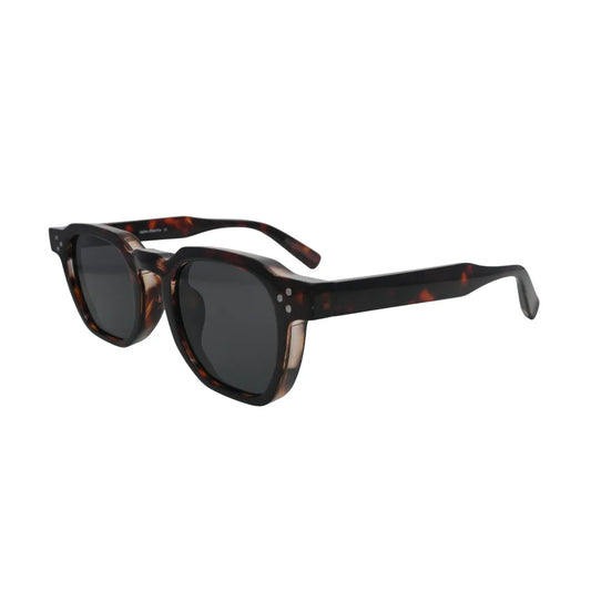 Three-quarter angle view of chunky tortoise shell square sunglasses showing full tortoise temple pattern and silver rivet hinge detail