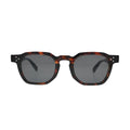 Front view of all-over tortoise shell square sunglasses with chamfered corners, notched bridge and dark smoke grey flat lenses