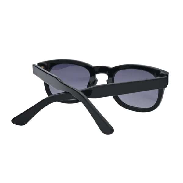 Back view of black round sunglasses with crossed temples and dark lenses