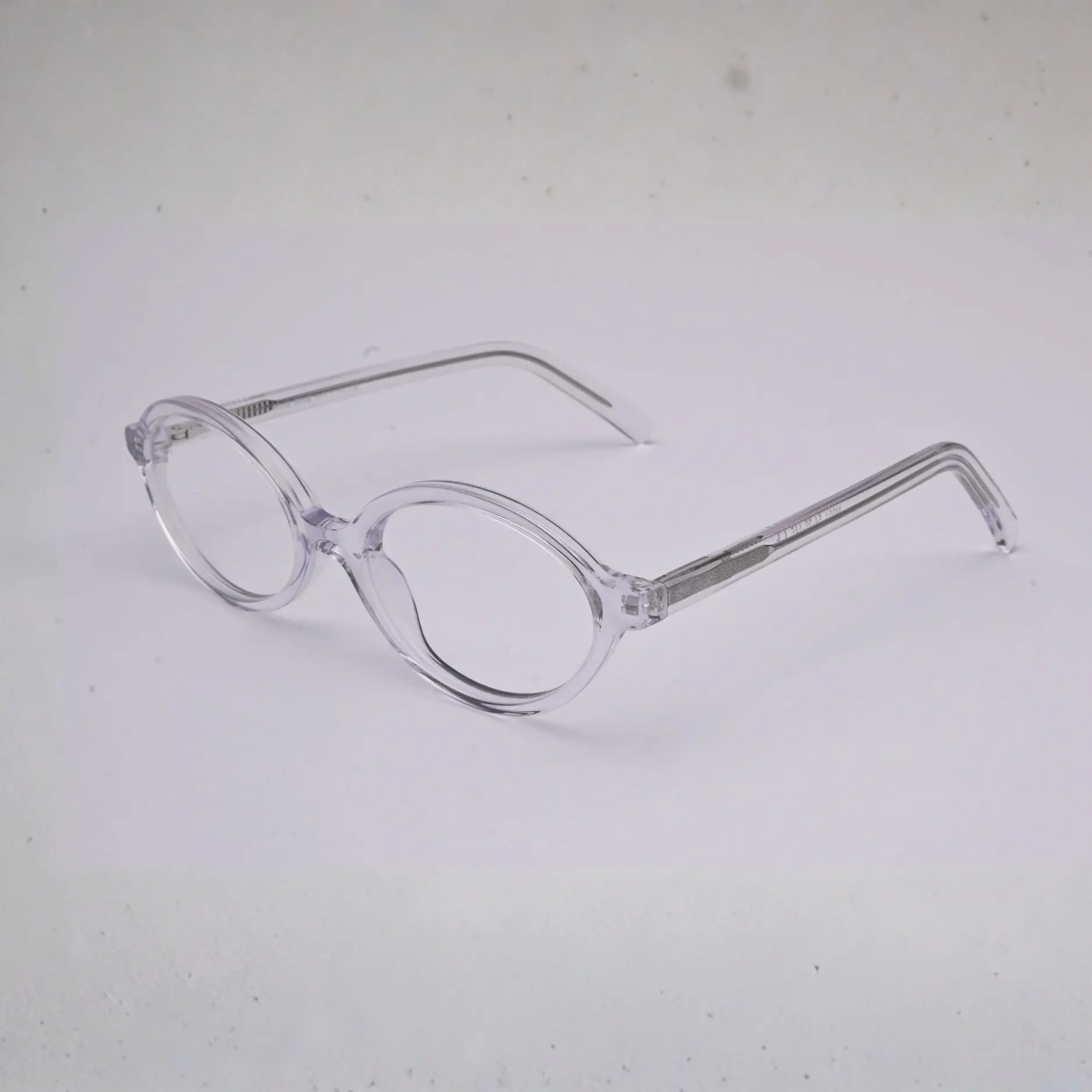 Side view of clear blush-pink full frame with visible metal core in temples (S036)