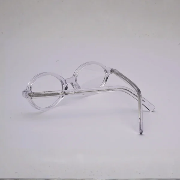 Side view of clear blush-pink full frame with visible metal core in temples (S036)