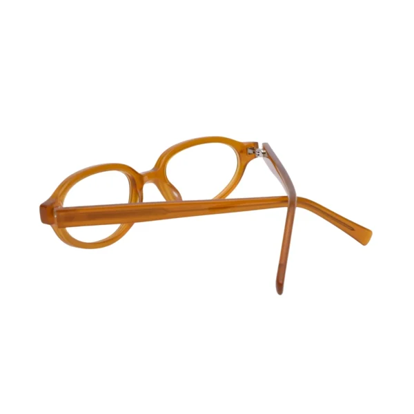 Hinge detail on amber plastic oval frame glasses