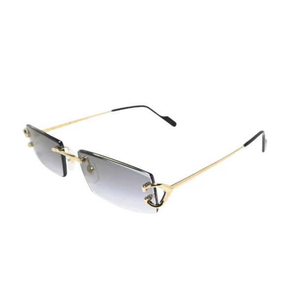 Three-quarter angle of grey gradient rimless Cartier sunglasses CT0465S001 with gold C-shaped hinge motif and bevelled lens edges