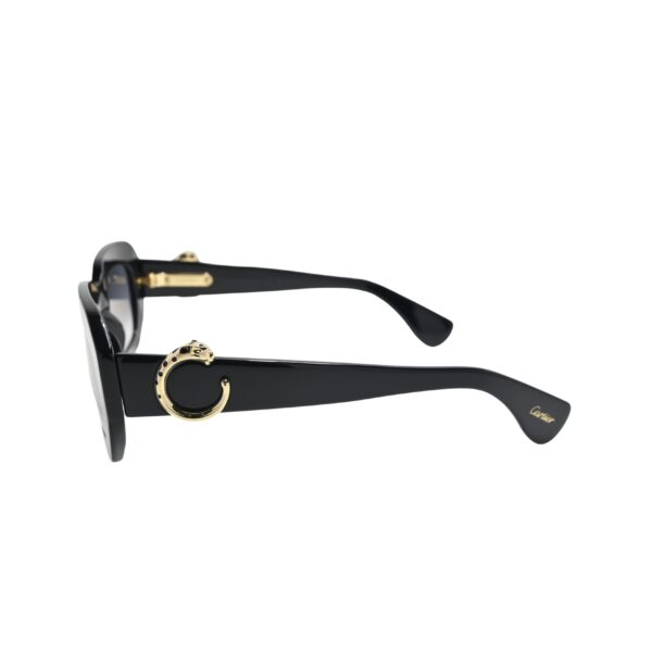 Side profile of Cartier CT0546S001 with gold panther ring detail and Cartier script at temple tip