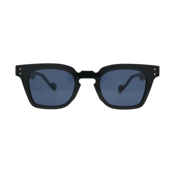 Front view of black square sunglasses with blue lenses showing thick frame, notched cutout bridge, and double silver rivets on temples